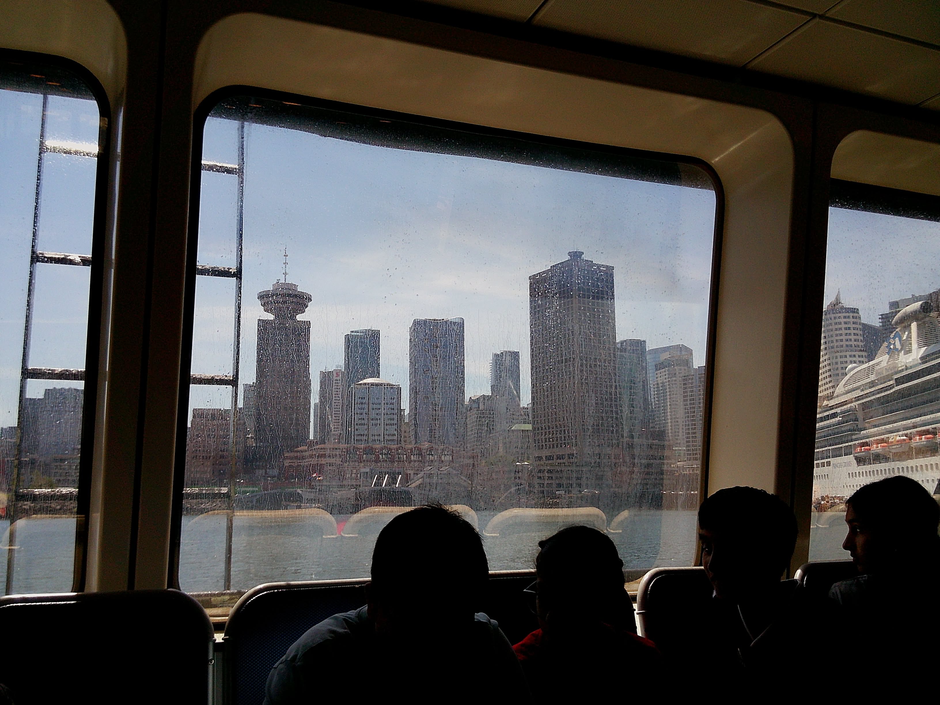 City skyline seen through a passenger vessel’s windows